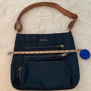Calvin Klein navy blue nylon brown strap crossbody